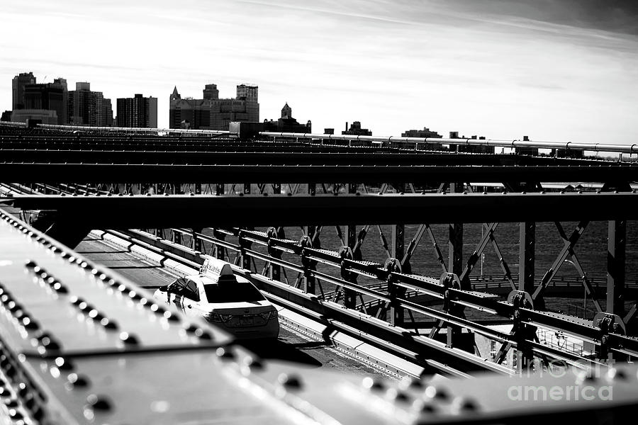 Brooklyn Bridge Taxi in New York City Photograph by John Rizzuto