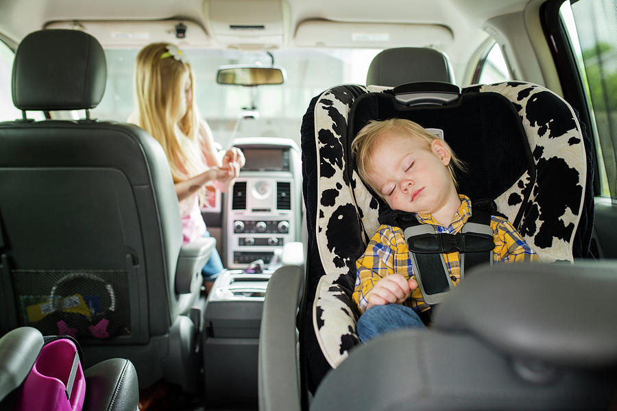 Transportation Photograph - Brother Sleeping While Sister Playing In Car by Cavan Images