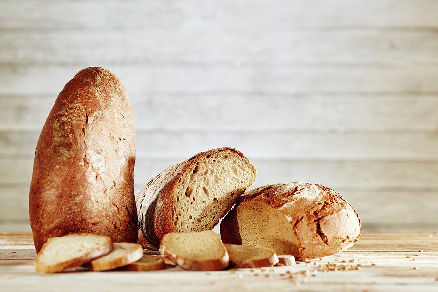 Brown Bread And Sourdough Bread Photograph by Niklas Thiemann