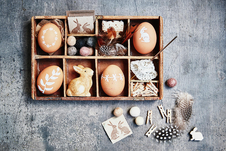 Brown Easter Eggs With White Motifs And Easter Decorations In Display Case Photograph by Brigitte Sporrer