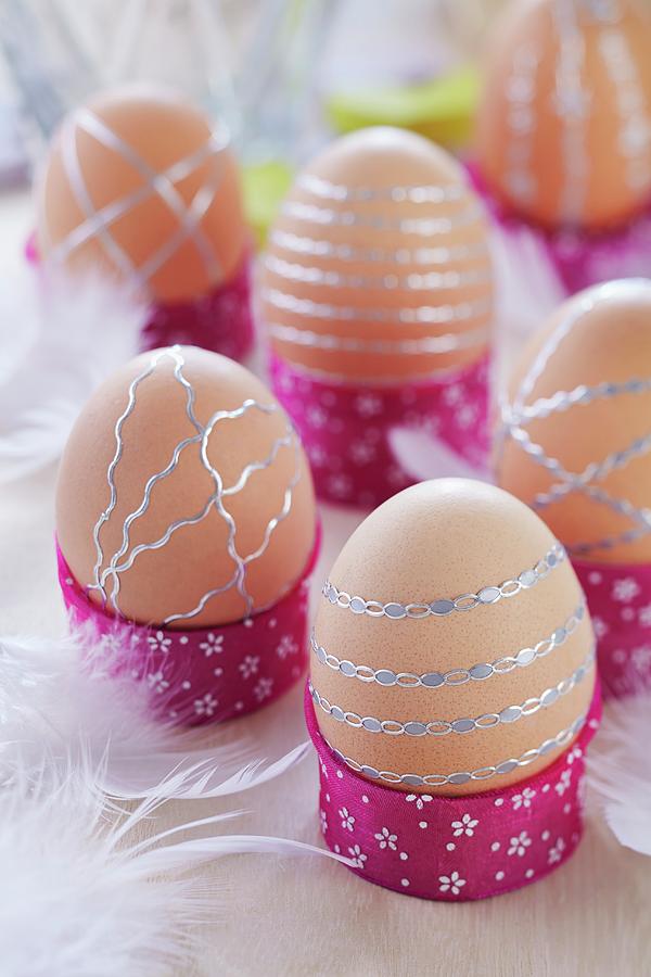 Brown Eggs Decorated With Strips Of Silver Stickers In Hand-crafted Egg Cups Photograph by Franziska Taube