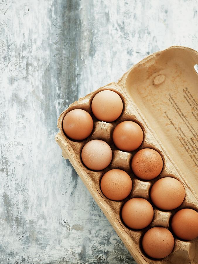 Brown Eggs In Egg Box Photograph by Mikkel Adsbl