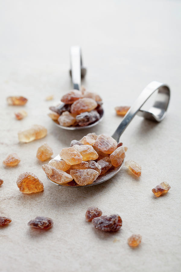 Brown Rock Sugar On Spoons Photograph by Kati Finell