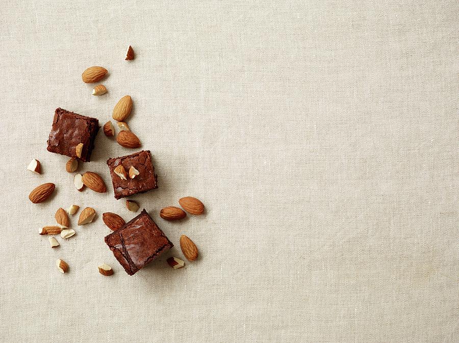 Brownies With Crispy Almonds Photograph by Leigh Beisch