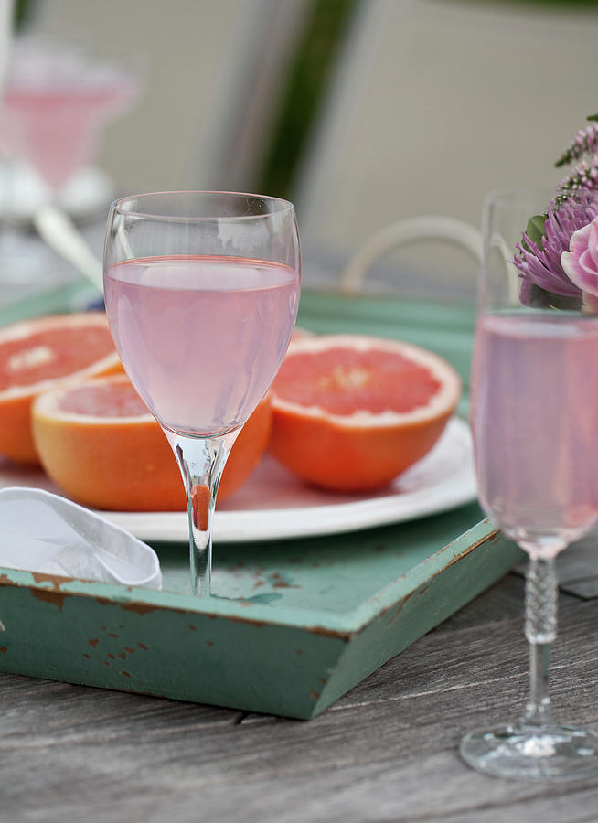 Brunch Outside, Flowers, Glasses Of Sparkling Pink Lemonade, Grapefruit Halves On An Outdoor Table Photograph by Ryla Campbell