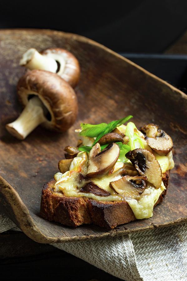 Bruscette Al Funghi grilled Bread Topped With Mushrooms On A Wooden Scoop Photograph by Charlotte Von Elm
