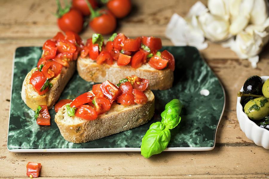 Bruschetta grilled Bread With Garlic, Tomatoes And Basil, Italy Photograph by Nicole Godt