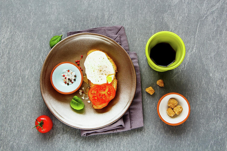 Bruschetta With A Poached Egg, Tomatoes And Coffee For Breakfast Photograph by Yuliya Gontar