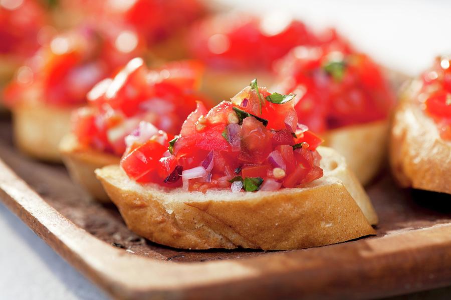 Bruschetta With Tomato And Basil Photograph by Creative Photo Services