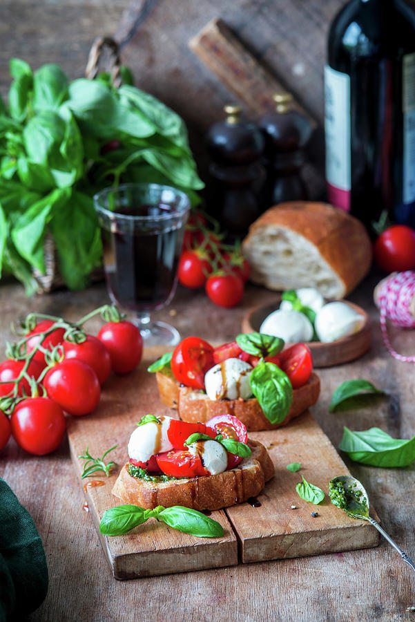 Bruschettas With Pesto, Mozzarella And Tomatoes Photograph by Irina Meliukh