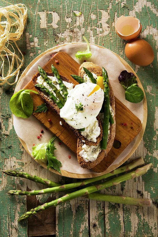 Bruschette Con Luovo In Camicia grilled Bread With Poached Egg, Italy Photograph by Blueberrystudio