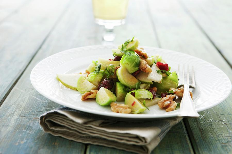 Brussels Sprout Salad With Pear And Walnuts Photograph by Mikkel Adsbl