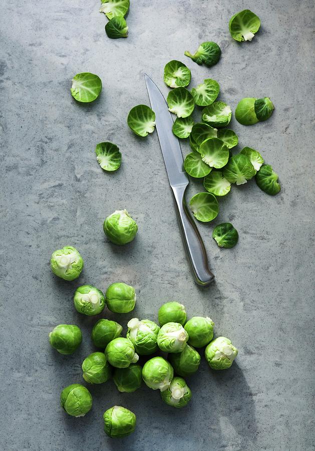 Brussels Sprouts With Discarded Leaves Photograph by Victoria Firmston
