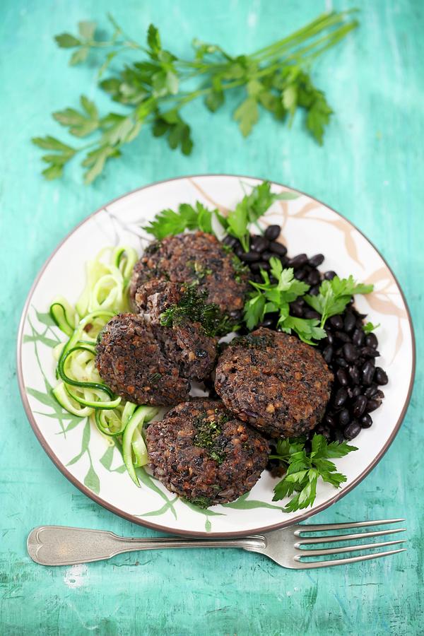 Buckwheat Patties With Black Beans And Courgette Noodles Photograph by Boguslaw Bialy