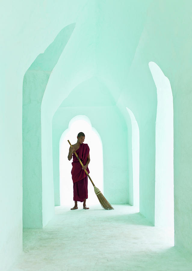 Buddhist Monk Sweeping Arced Temple Photograph by Martin Puddy