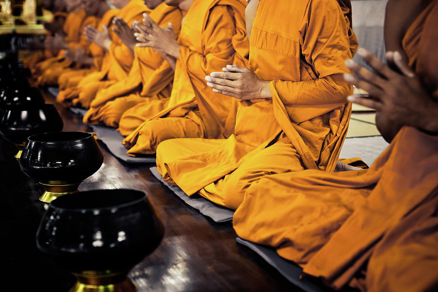 Buddhist Monks Praying Photograph by Fredfroese