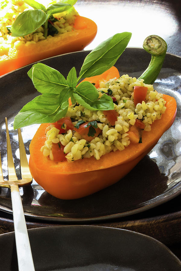 Bulgur Salad With Tomatoes And Herbs Served In A Pepper Photograph by Charlotte Von Elm