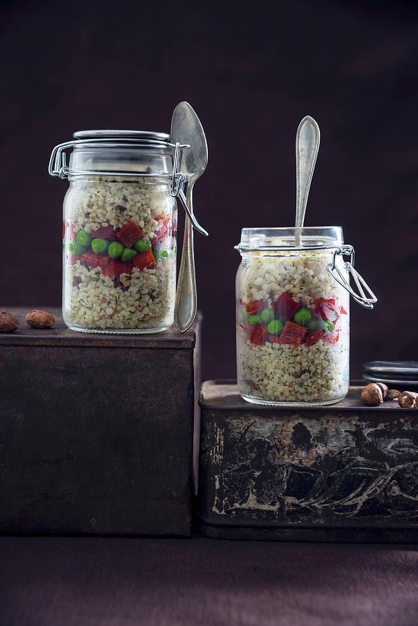 Bulgur Wheat Salad With Hazelnuts, Peppers And Peas In Glass Jars Photograph by Kati Neudert