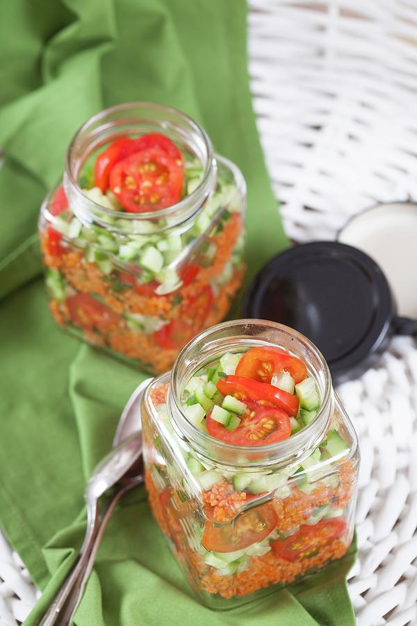 Bulgur Wheat Salad With Pomegranate Syrup, Onions, Cucumber, Tomatoes, Parsley And Mint In A Glass Jar Photograph by Elisabeth Von Plnitz-eisfeld