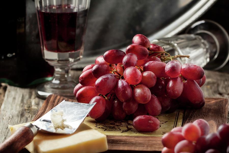 Bunch Of Red Grapes With Cheese And A Vintage Glass Of Red Wine Photograph by Natasha Breen