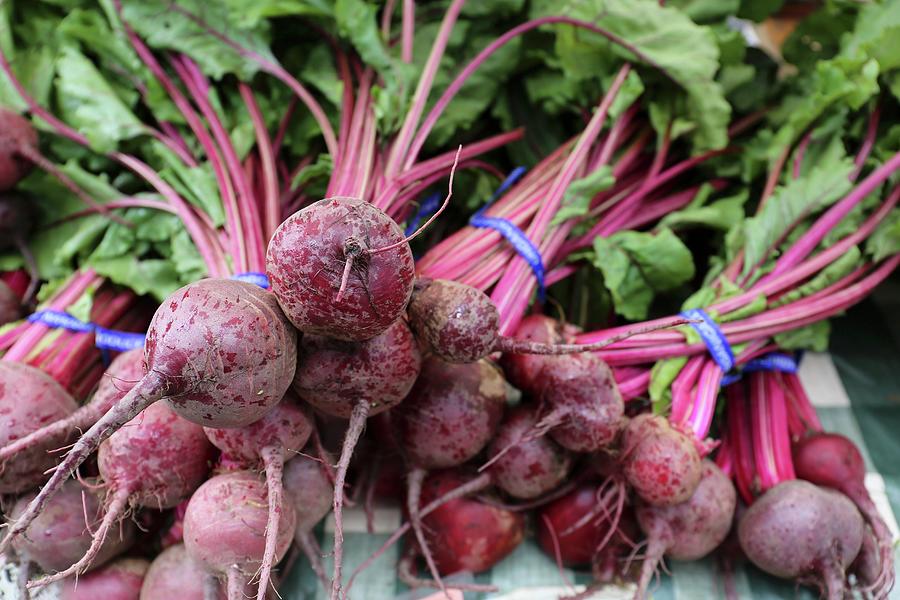 Bunches Of Organic Beetroot At A Market Photograph by Bayle Doetch