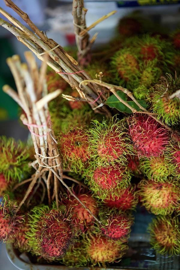 Fruit Photograph - Bunches Of Rambutan by Joff Lee Studios