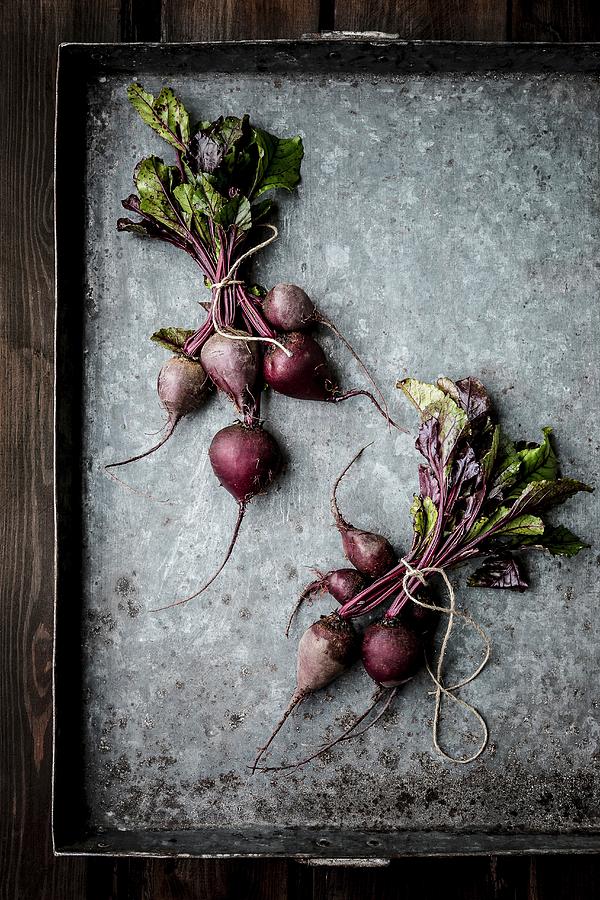 Bundles Of Beetroot On A Baking Tray Photograph by Sarah Coghill