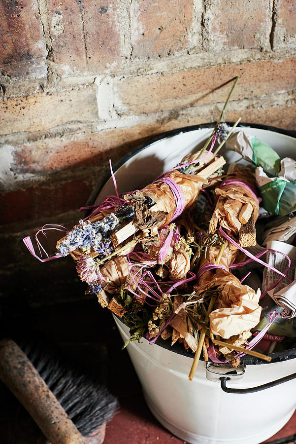 Bundles Of Kindling And Herbs Tied With Raffia In Bucket Photograph by Catherine Gratwicke