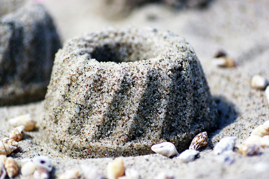 Bundt Cake Made Of Sand And Seashells On Beach Photograph by Angelica Linnhoff
