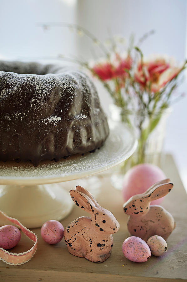 Bundt Cake With Chocolate Glaze And Easter Decorations Photograph by Michael Lffler