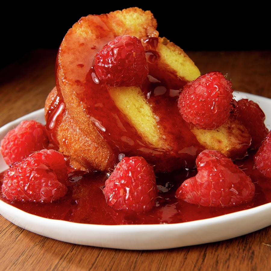 Bundt Cake With Raspberries And Sauce Photograph by Paul Poplis