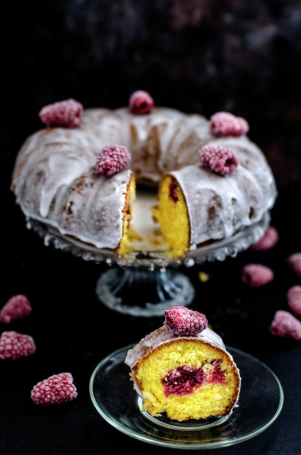 Bundt Polenta Cake With Raspberry On A Black Surface Photograph by Gorobina