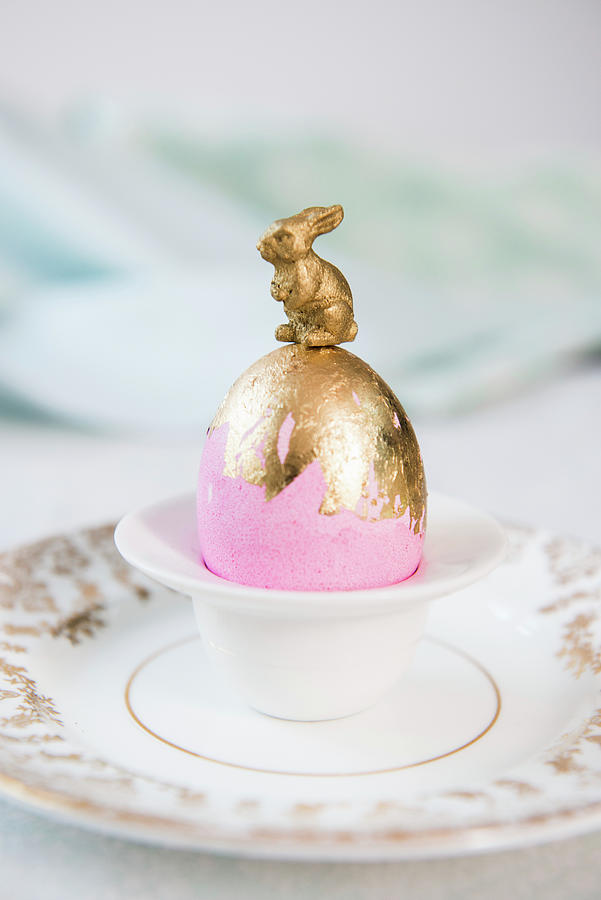Bunny On Top Of Pink Easter Egg With Gold Leaf Photograph by Ruud Pos