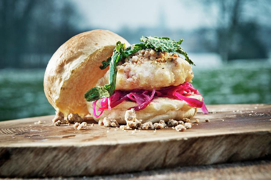 Burger With Cabbage On A Tree Stump Outdoors camping Photograph by Lode Greven Photography