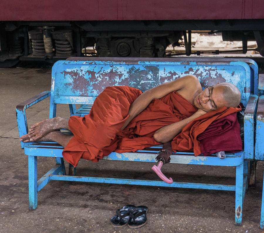 Burmese monk resting on bench Photograph by Ann Moore
