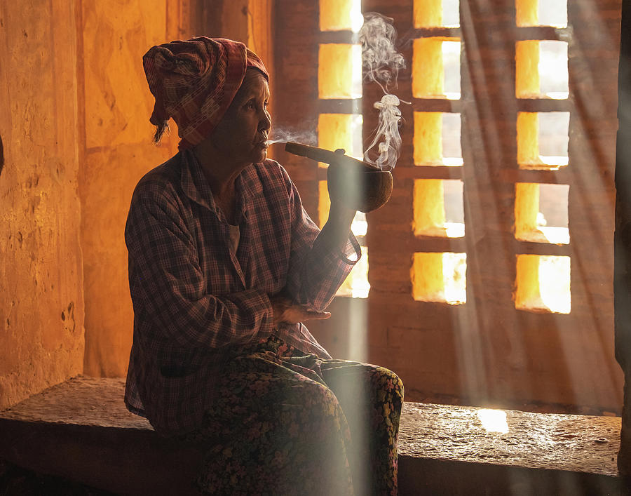 Burmese woman smoking a cigar Photograph by Ann Moore