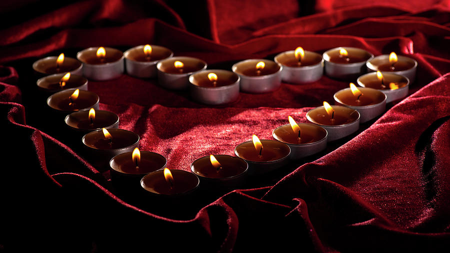 Burning heart of candles Photograph by Ina Osovskaja - Fine Art