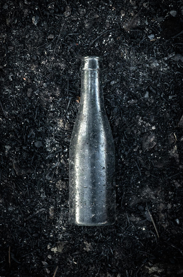 Burnt Bottle Photograph by Carlos Caetano