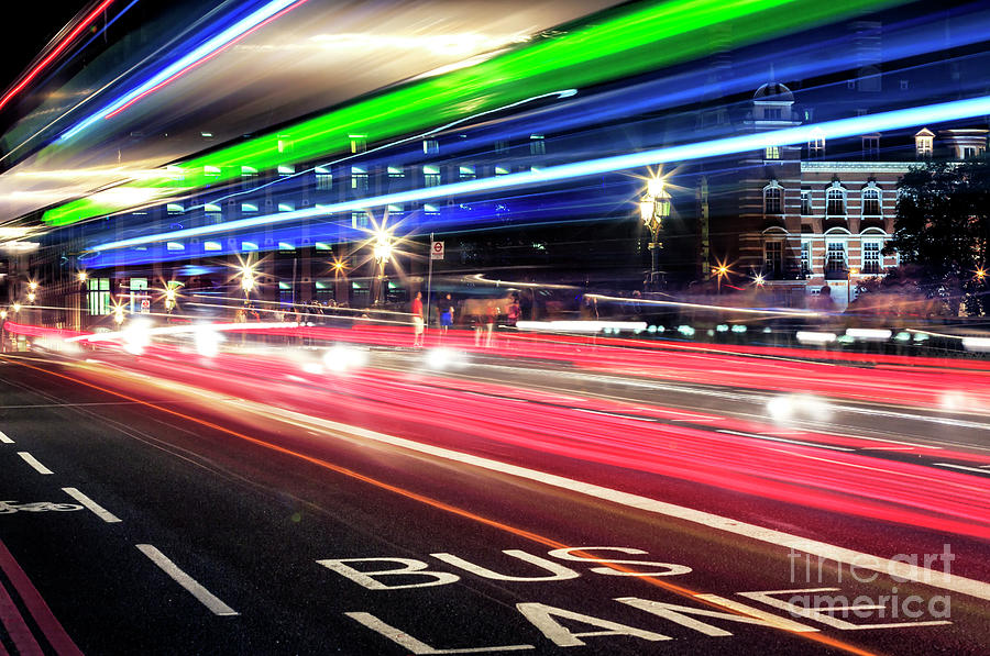 Westminster Photograph - Bus Lane at Night in London by John Rizzuto