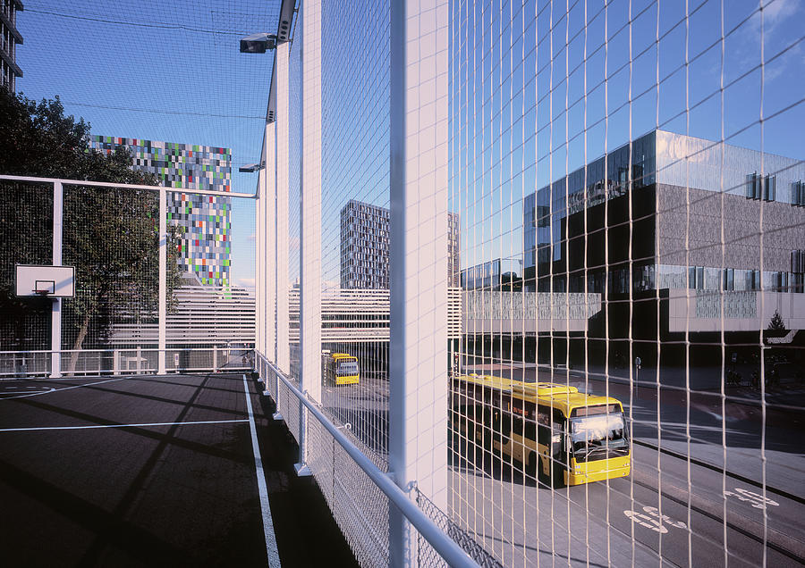 Bus Passing Elevated Basketball Court Photograph by Eschcollection