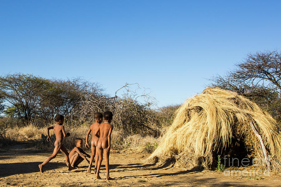 Portrait Photograph - Bushmen children a9 by Eyal Bartov