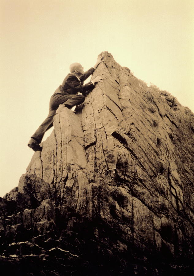 Businessman Climbing Jagged Rock, Low Photograph by Betsie Van Der Meer