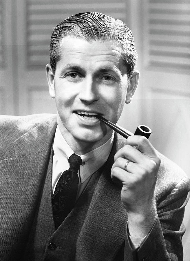 Businessman Smoking A Pipe Photograph by George Marks