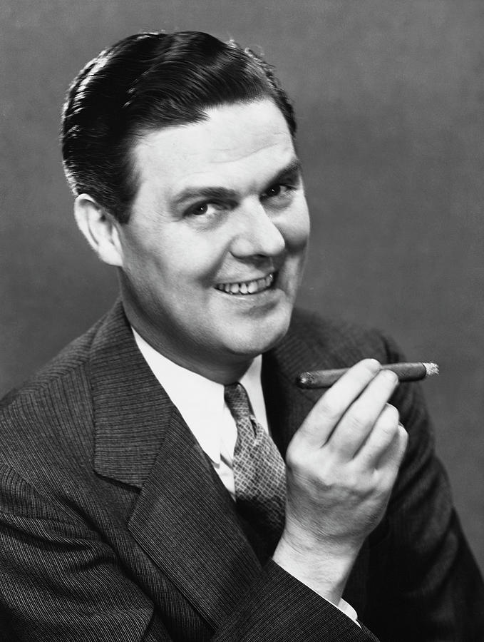 Businessman Smoking Cigar Photograph by George Marks