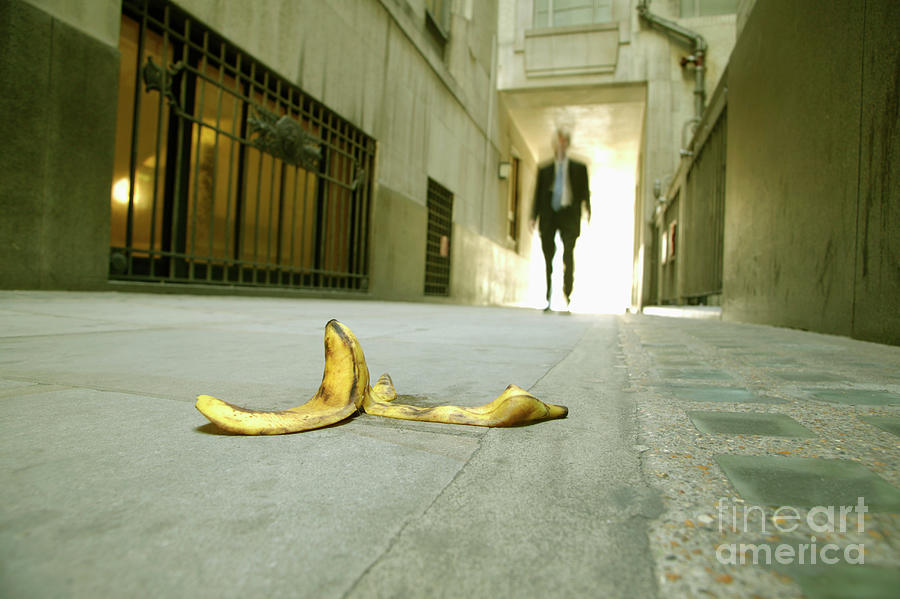 Businessman Walking Towards Banana Skin Photograph by Conceptual Images/science Photo Library