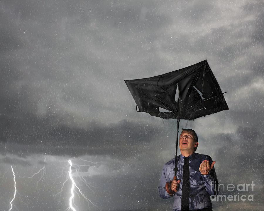 Businessman With Broken Umbrella In A Storm Photograph by Conceptual Images/science Photo Library