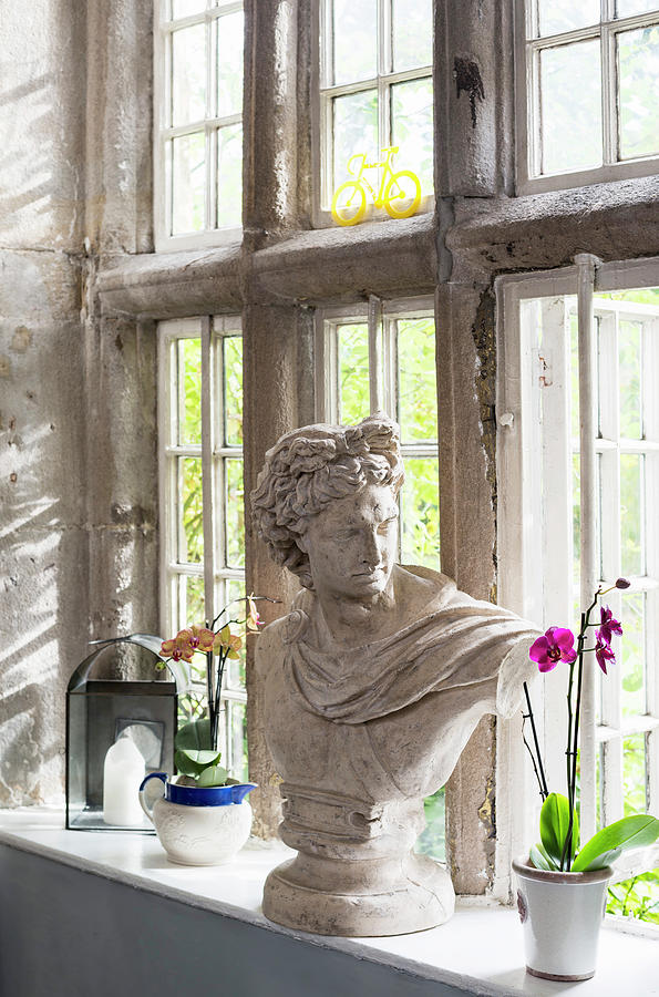 Bust And Orchids On Sill Of Old Lattice Window With Stone Frame Photograph by Brian Harrison