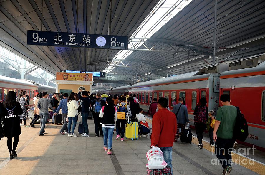 Busy platform with passengers exiting trains and greeting at Beijing Railway Station China Photograph by Imran Ahmed