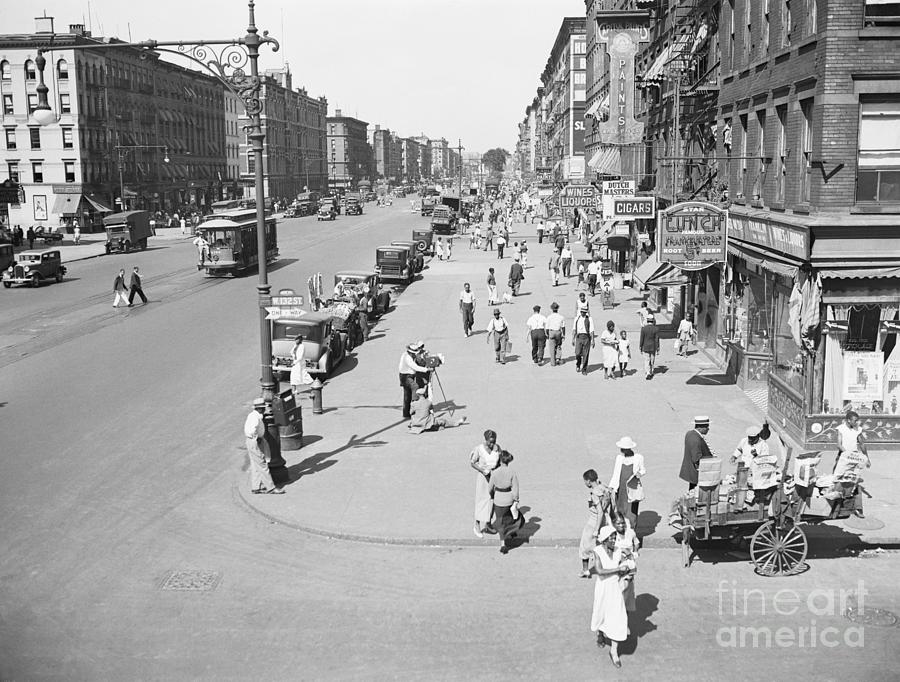 Busy Street In Harlem, New York Photograph by Bettmann
