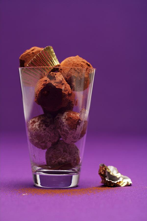 Butter And Cinnamon Truffles In A Glass Photograph by Michael Wissing